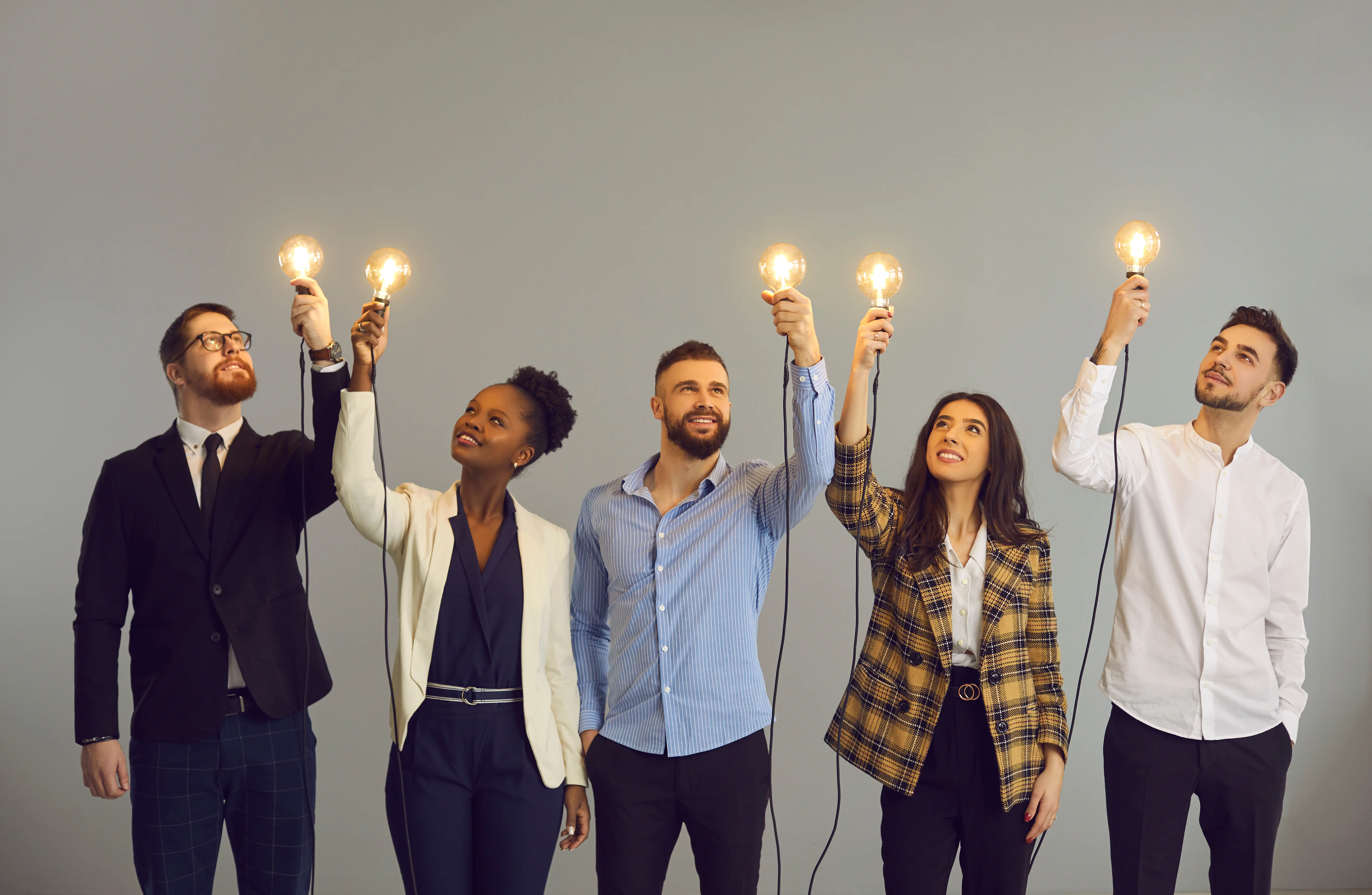 Group holding lightbulbs